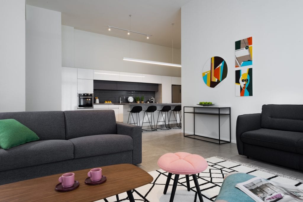 Modern and functional kitchen in the Five-Bedroom Duplex Garden at master Shenkin Tel Aviv, featuring sleek cabinetry and contemporary appliances
