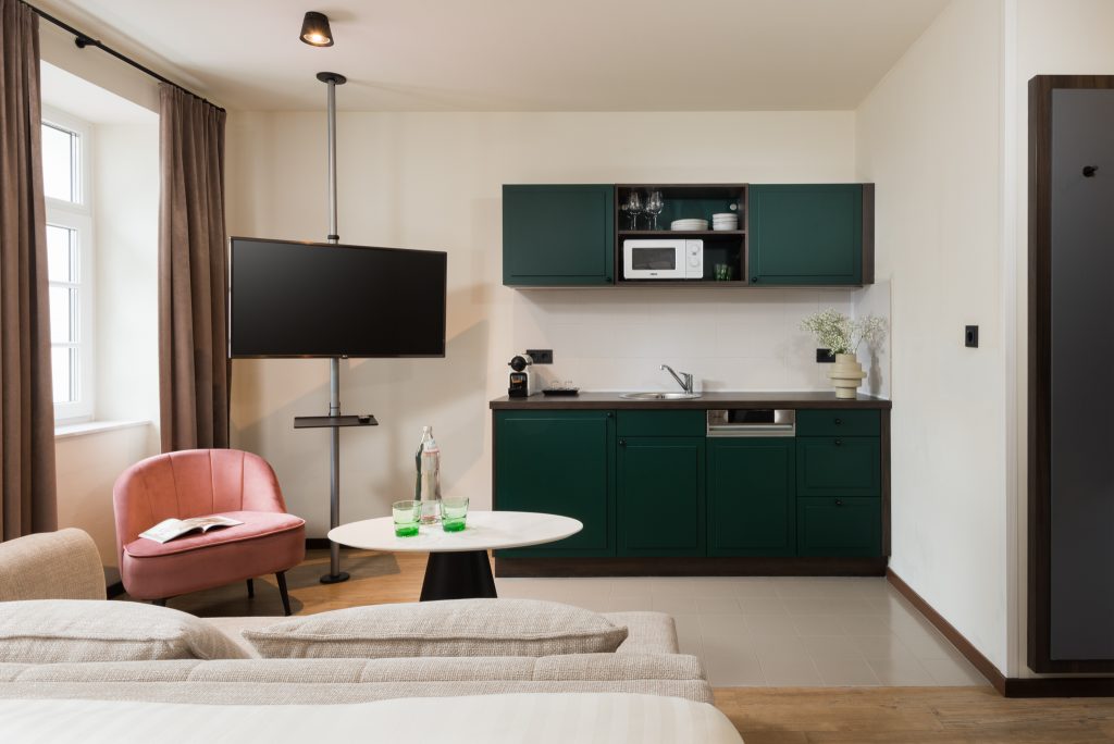 Sleek and practical kitchen in the deluxe studio at master Mirabell.