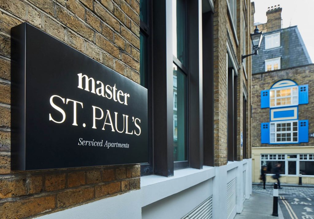 Entrance of master St. Paul’s London, featuring the illuminated master sign on the building’s facade