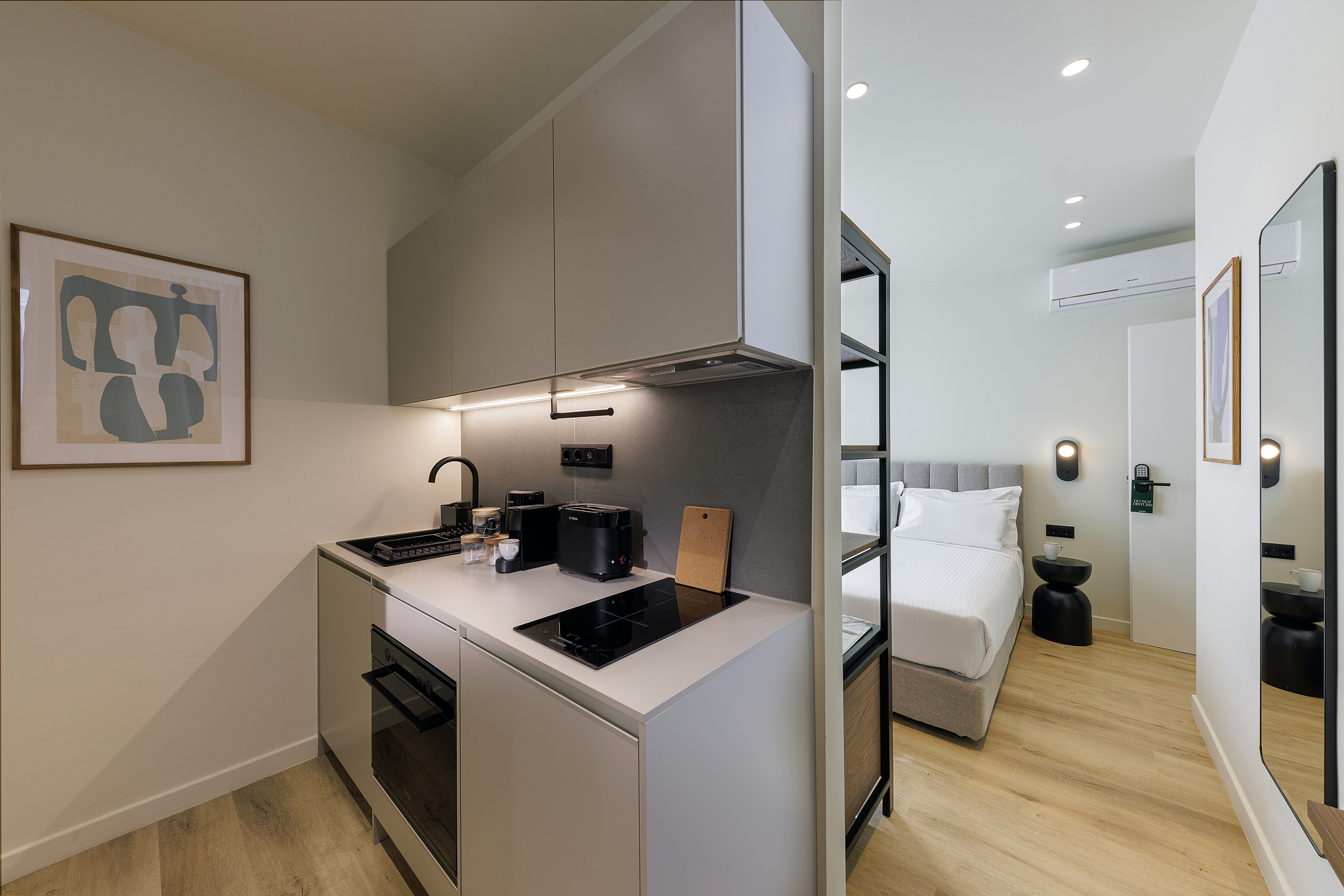 Fully equipped kitchen in the Studio Apartment at master Plaka Athens, offering modern appliances and a sleek, functional layout.