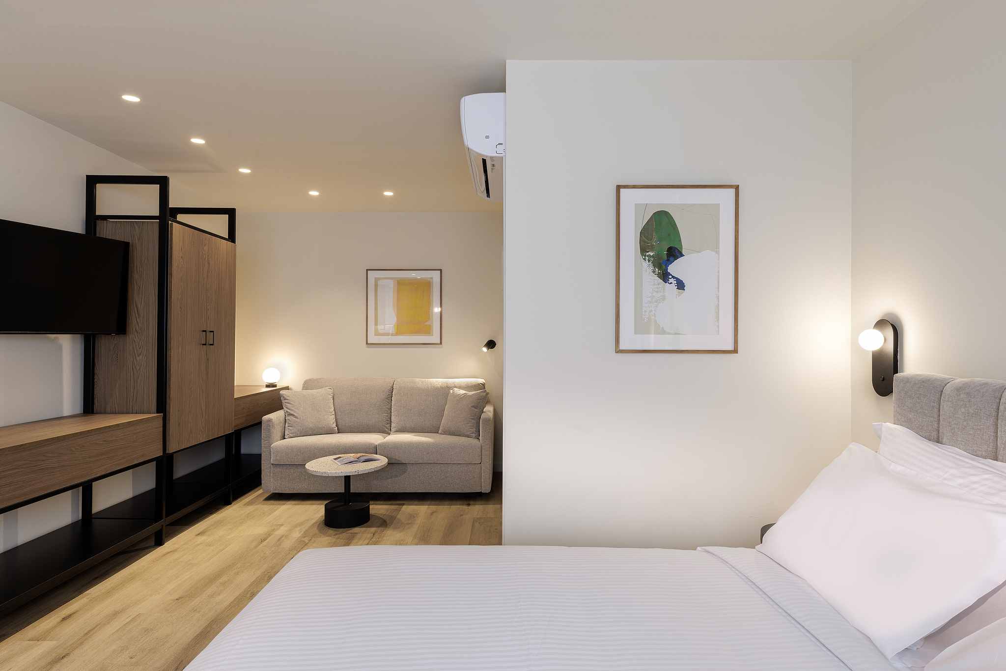 Inviting sleeping area in the Studio with Sofa Bed at master Plaka Athens, blending comfort with contemporary design.