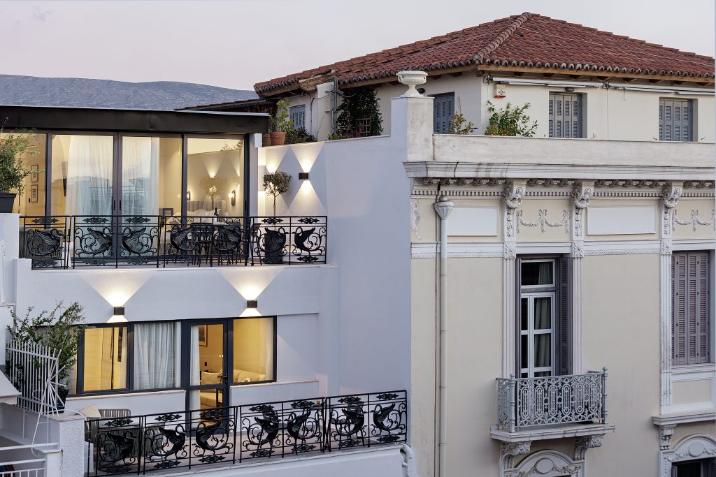Exterior of master Plaka Athens, a modern serviced apartment building blending seamlessly with the historic charm of the Plaka neighborhood.