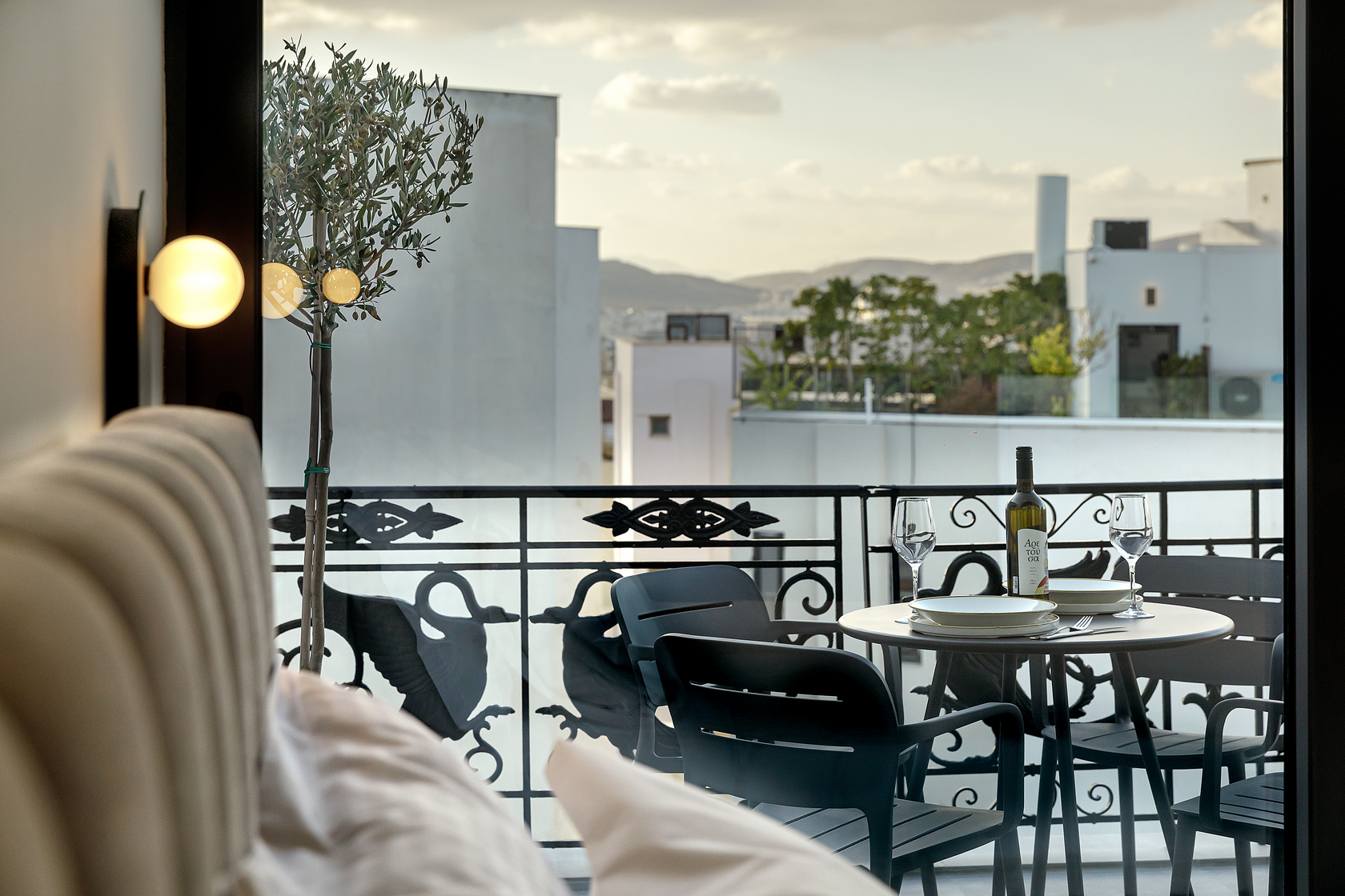 Spacious private balcony in the One Bedroom Penthouse at master Plaka Athens, offering a relaxing outdoor retreat with cityscape views.