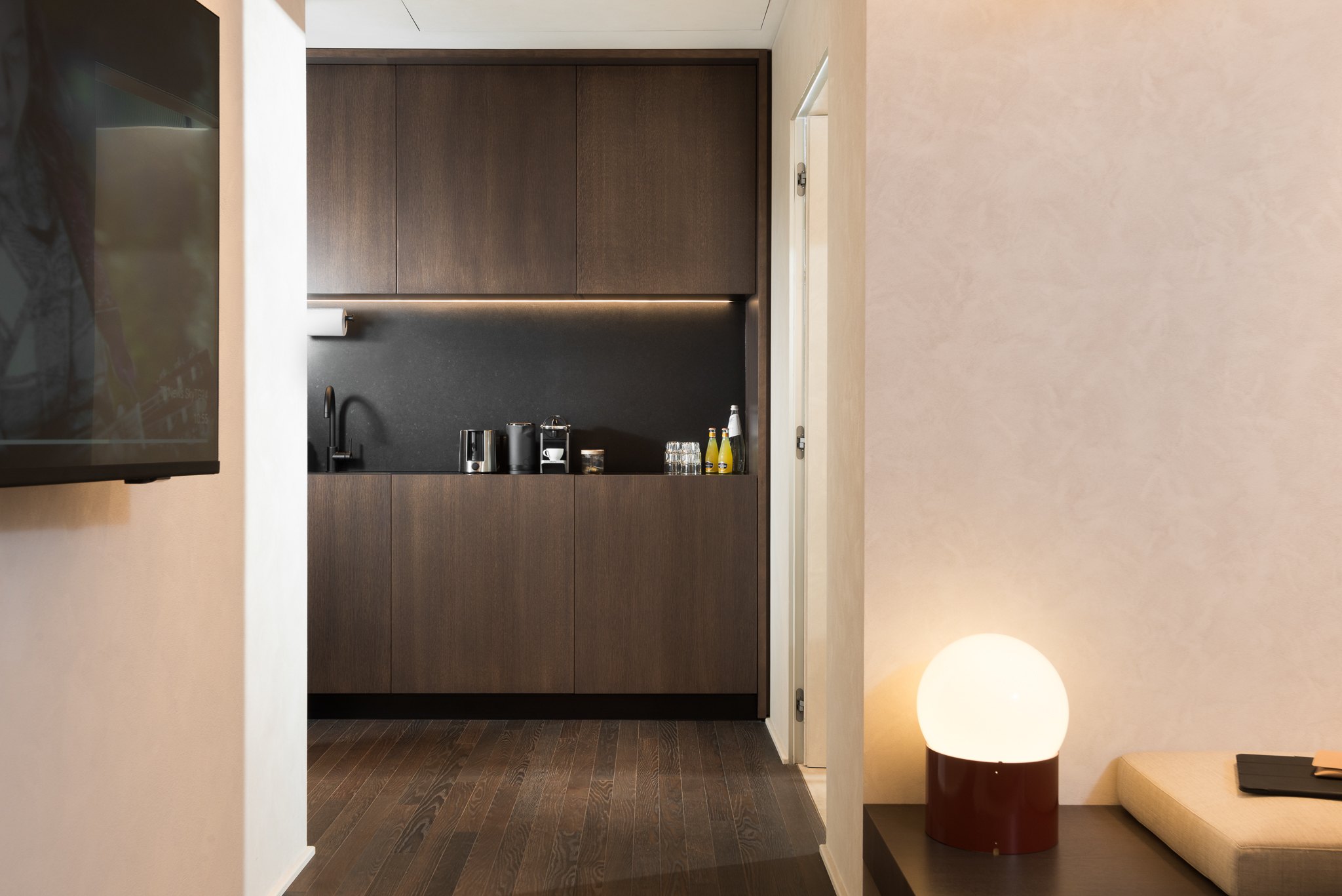 Modern kitchenette in the Studio Apartment at master Trevi Rome, equipped with sleek appliances and a functional layout for convenience.