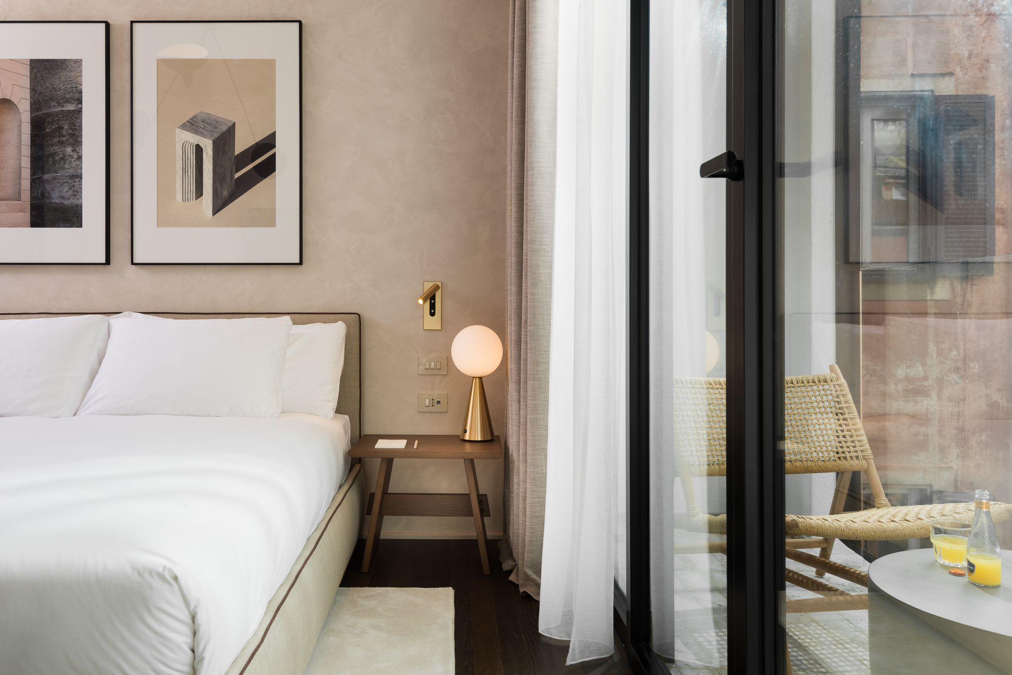 Plush bed in the Family Apartment at master Trevi Rome, designed with soft textures and warm lighting for a restful stay.