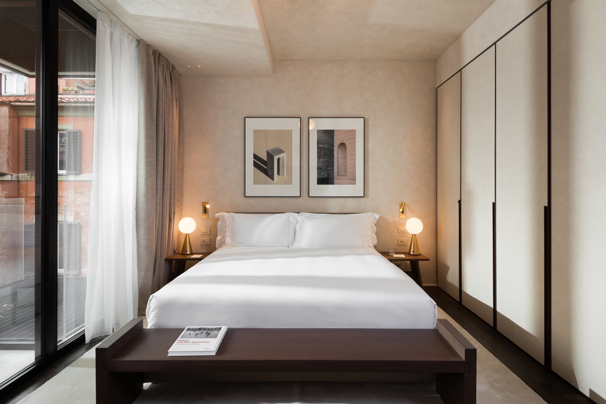 Cozy bed in the Studio with Balcony at master Trevi Rome, set in a thoughtfully designed space for a restful stay.
