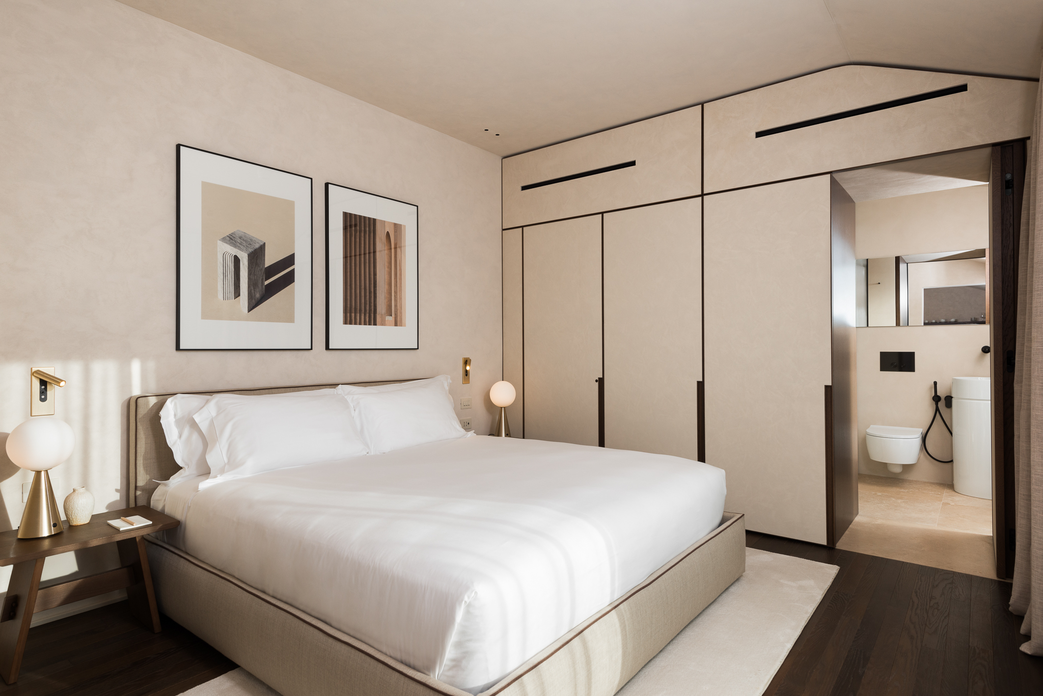 Spacious and cozy bedroom in the Two-Bedroom Penthouse at master Trevi Rome, designed for ultimate comfort and relaxation.