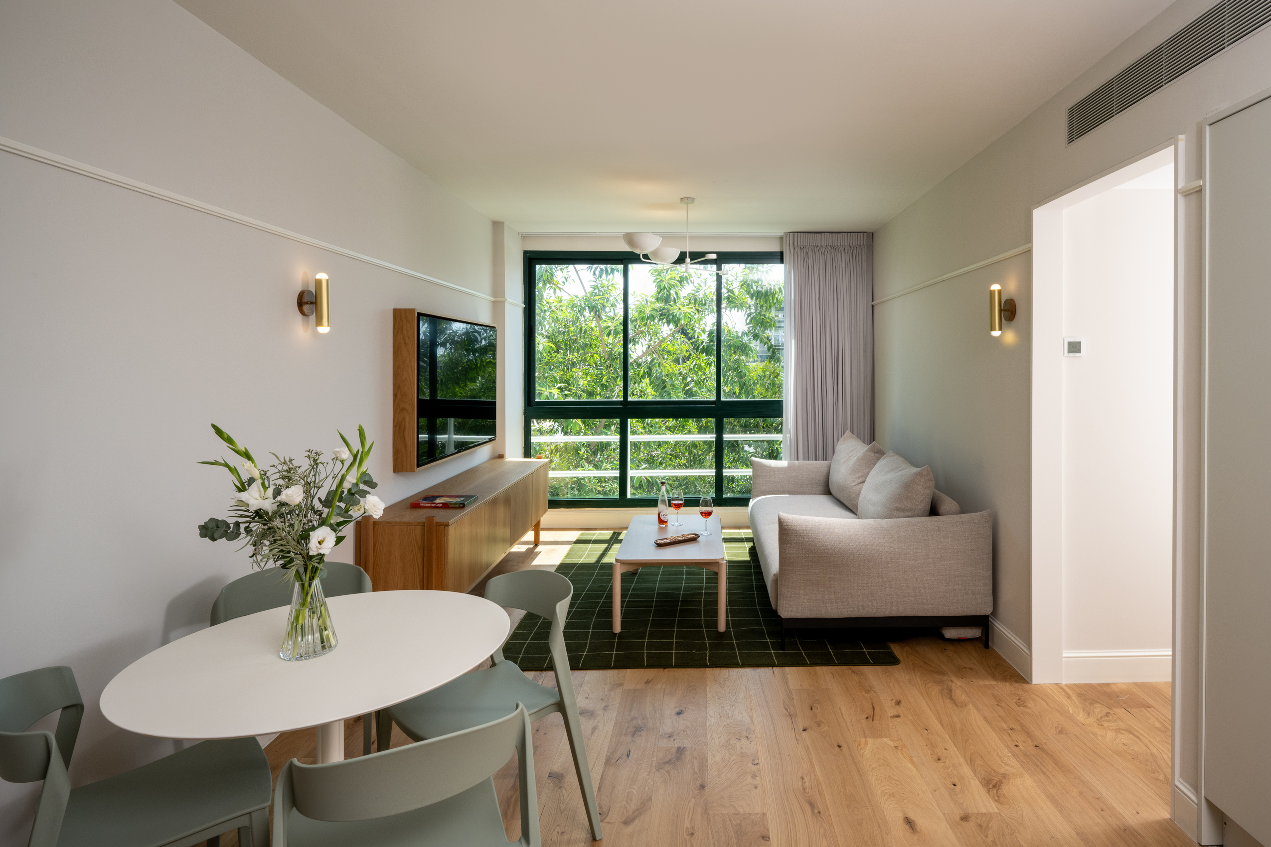 Spacious and inviting living area in the One-Bedroom with Big Terrace & Sofa Bed at master Mazeh Tel Aviv, featuring a cozy sofa and modern decor