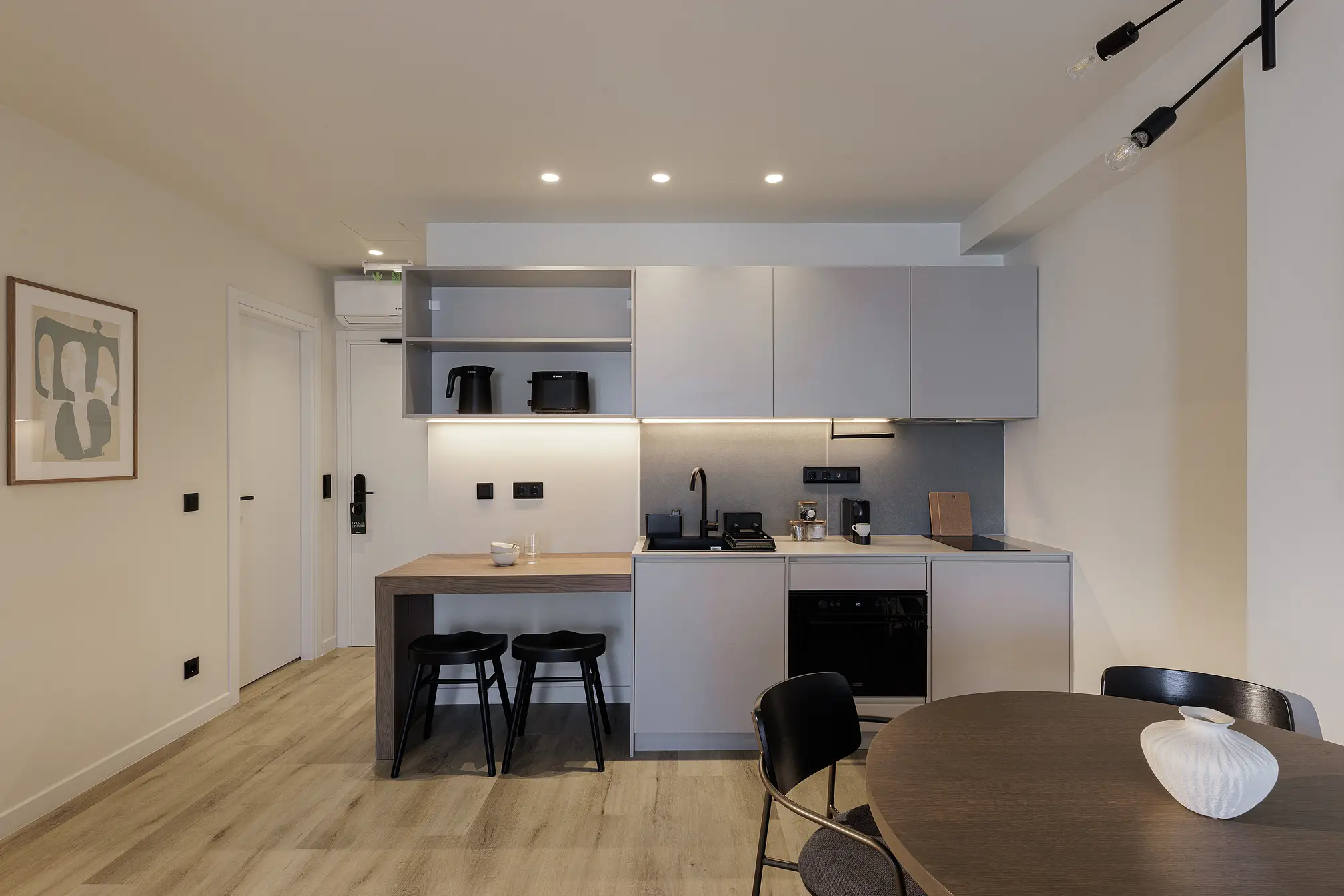 Modern kitchen in the One Bedroom Apartment with Balcony at master Plaka Athens, equipped with sleek appliances and a functional layout.